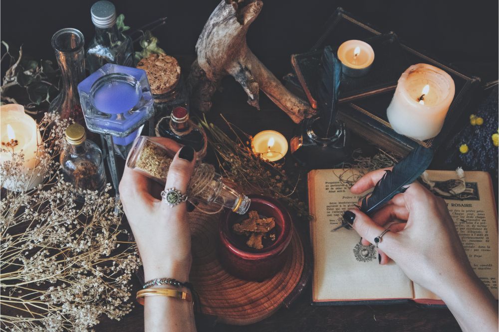 A witch casting a spell and writing it down in her Book