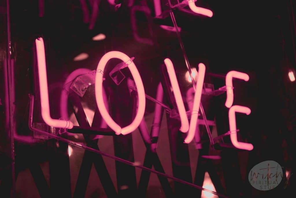 a neon sign that says love
